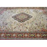 Large Persian cream ground carpet with central shaped medallion and floral motifs, multiple borders,