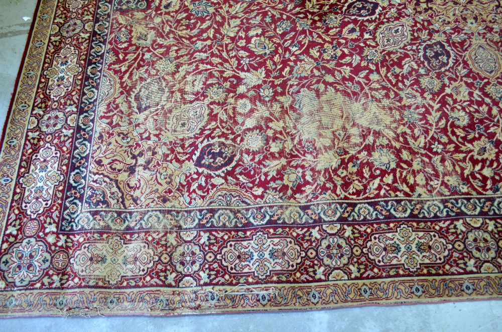 Large Persian red ground carpet with central shaped medallion and floral motifs, with multiple - Image 3 of 9