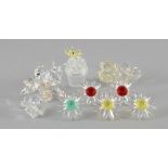 Swarovski crystal flowers to include vase of roses, two flowers in pots, bee on a clear flower,