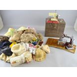 Two toy sewing machines and collection of doll's clothes, wigs, etc., Provenance:  From a single