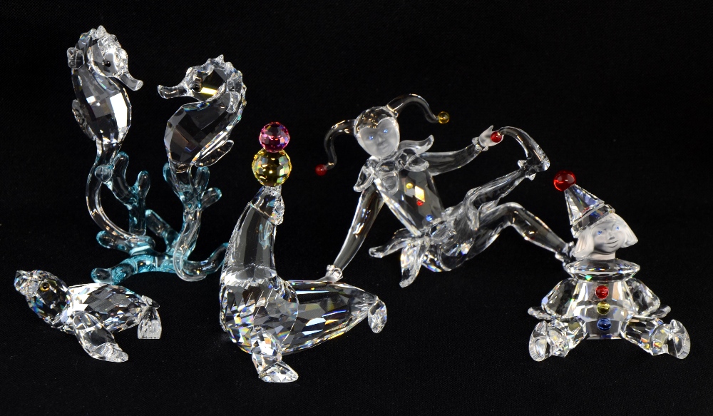 Swarovski crystal glass, two clowns, juggling sea lion, seahorses and seal, boxed.