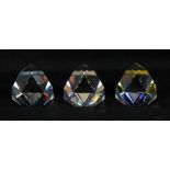 Three Swarovski Octron paperweights in clear no. 013491, pinks and purples no.015057 and one in