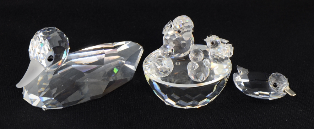 Swarovski crystal mallard duck and a birds nest with mother and three chicks and a single duck