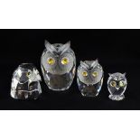 Swarovski crystal three clear owls of various sizes with coloured eyes and a small falcons head,