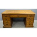 Modern oak desk with four drawers and two deep drawers