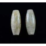 Two Chinese carved hardstone beads of elongated ovoid form, each 3.5cm long,Wear.