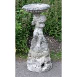 Composite stone garden bird bath/fountain of a cherubHeavy damage to rim of bird bath