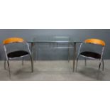 Modern chrome and glass topped dining table and set of four chairs