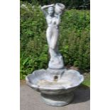 20th century fountain in the form of a classical lady holding an urn standing above a shell, 155cm