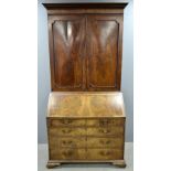 George III mahogany bureau bookcase, top with two doors over base with fall flap revealing
