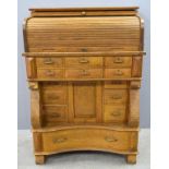 Architect's oak  desk, with tambour front over six small drawers above a central cupboard door