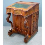 19th century Walnut Davenport, with green leather and gilt tooled writing slope, raised on