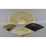 Four 19th C fans. Spanish carved hardwood sequinned fan, two bone fans and another lacquered wood