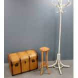 Dome top trunk with a carved plant stand and bentwood coat stand