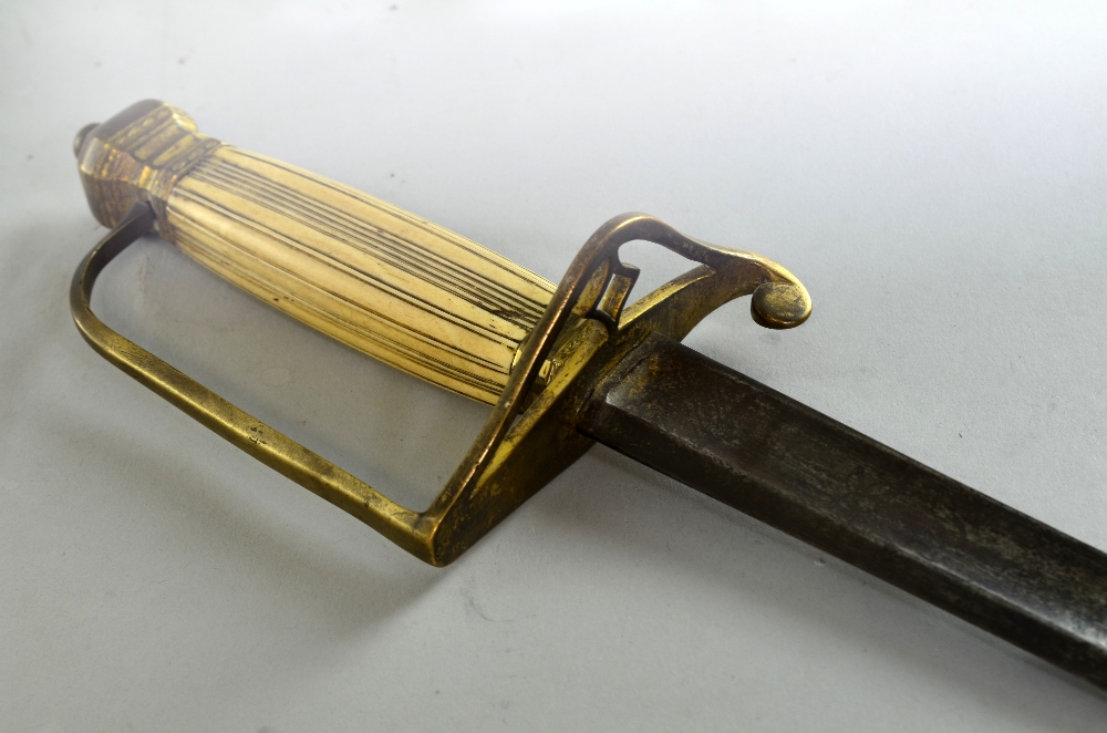 George III officer's sword, with brass and ivory hilt, the blade engraved with Royal Coat of arms