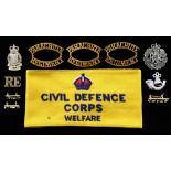 Civil Defence arm band and collection of badges