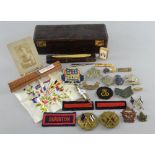 Scottish Kings Borderers silver plated badge and a collection of military badges and other related