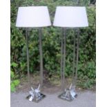 Pair of chrome standard lamps and a pair of matching bedside lamps
