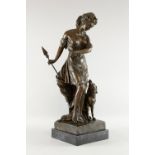 A contemporary bronze large figure of a lady with arrow and sporting dog