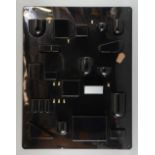 Dorothy Maurer -Becher Wall All. for Design M Munich, a wall organiser in black plastic designed