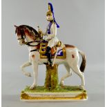 Dresden figure of a military officer in white and blue uniform riding a horse, titled 'Garde