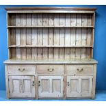 Pine dresser, top with plate rack and hanging hooks, over base with three deep drawers above