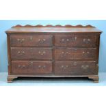 Oak merchants chest of six drawers on ogee bracket feet, 95cm x 173cm x 55cm