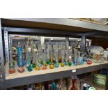 Collection of clear and coloured glass posy vases and paperweights,