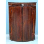 Oak wall hanging bowfront corner cupboard with two doors, and parquetry inlay, 103cm x 71cm x 48cm