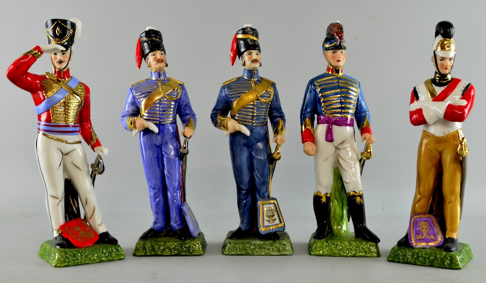 Three continental studies of soldiers in blue uniforms, gold braiding and silver swords, and a