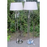 Pair of chrome standard lamps and a pair of matching bedside lampsIn good overall condition