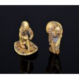 Japanese ivory Netsuke of a blind man with a stick trying to find a hole in a lily (5cm high), and