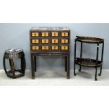 Black lacquered storage chest on stand decorated in the Japanese manner, similar decorated trolley