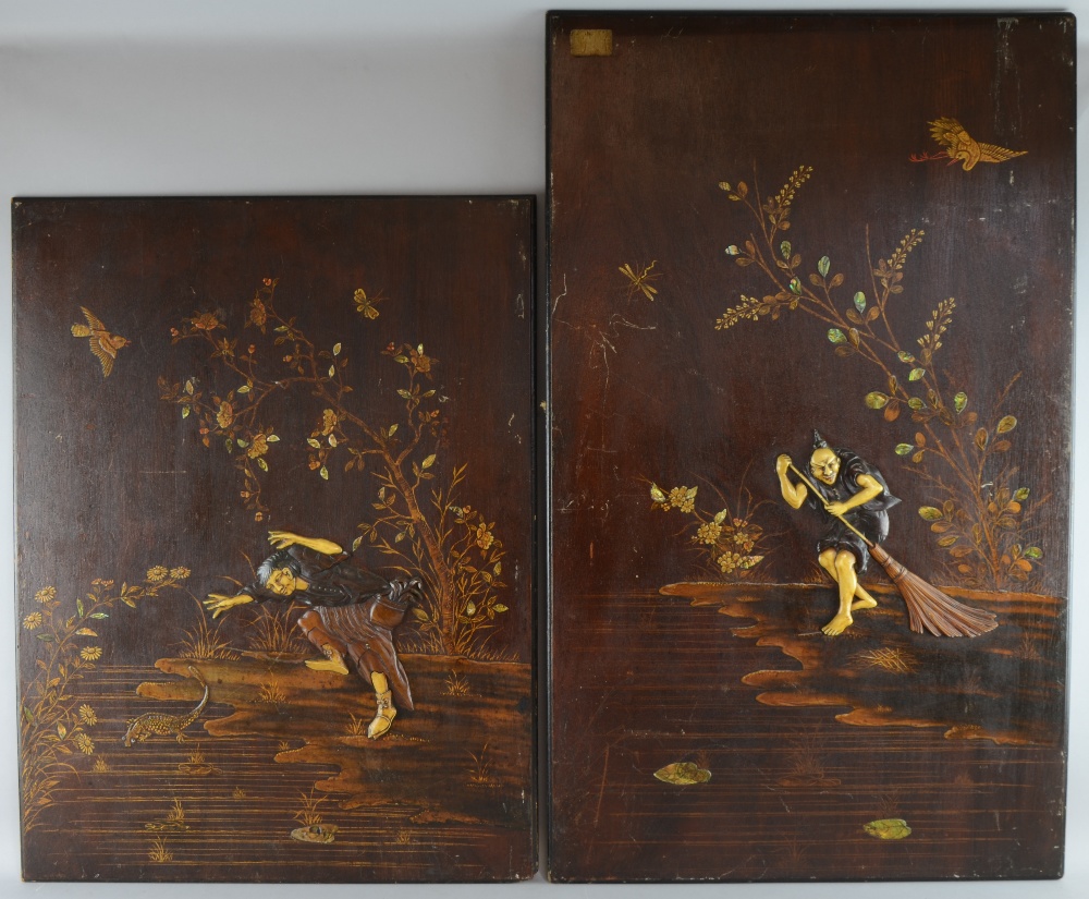 Two Japanese panels, depicting figures of carved ivory in a landscape. further mother of pearl inlay