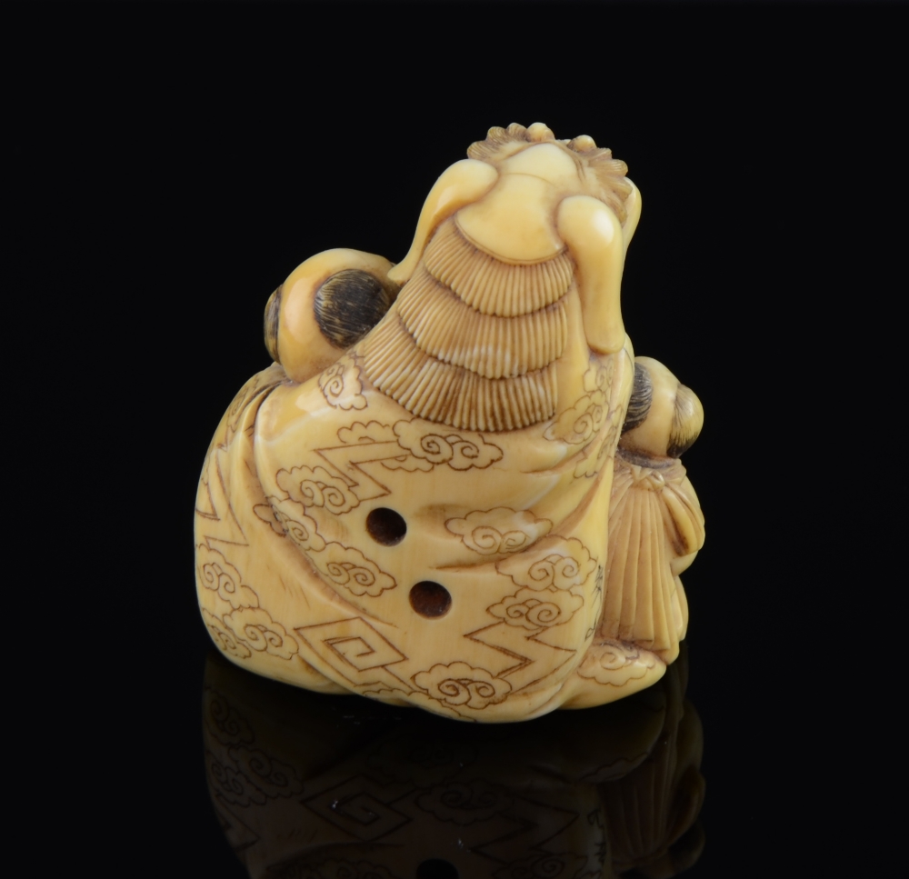 Carved Ivory Netsuke of 'The Lion festival Dog' with two attendants signedGood condition overall - Image 2 of 2