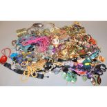 A large quantity of fashion jewellery to include necklaces and other items.