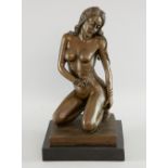 A contemporary bronze nude study of a young lady kneeling