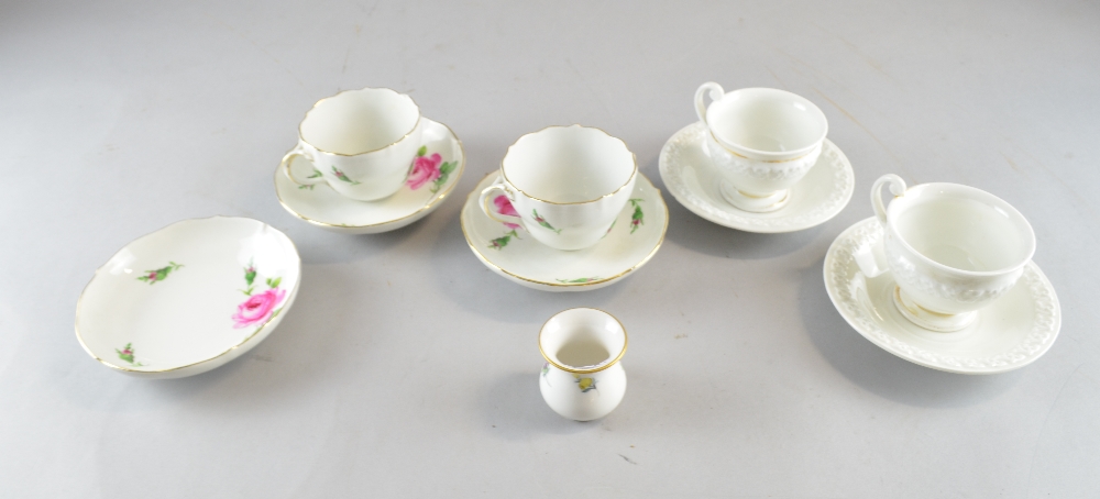 Meissen porcelain comprising, two white glazed cups and saucers with gilt banding, two cups and