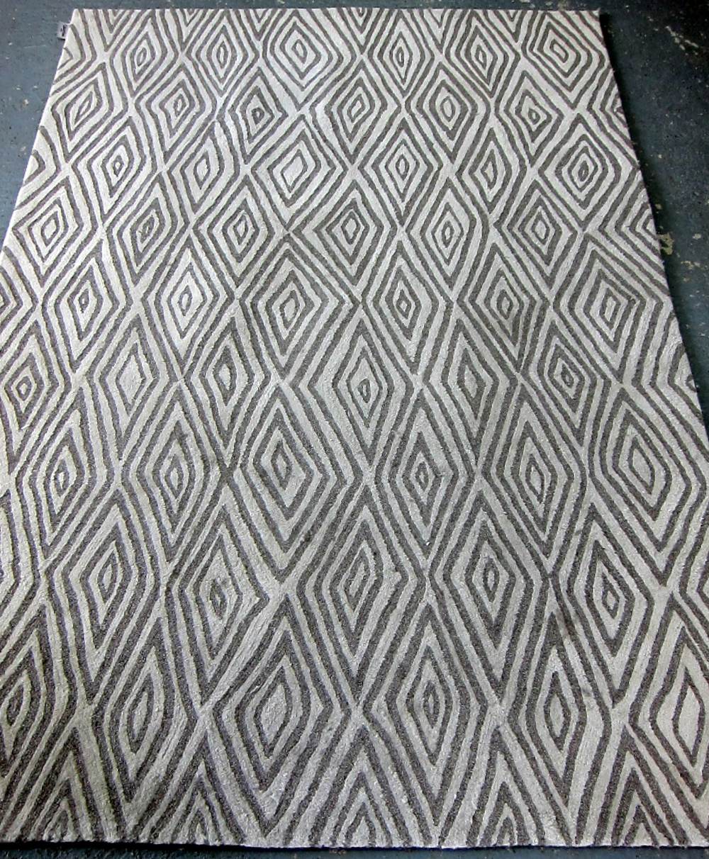 Calvin Klein rug with cream ground and grey lozenge design