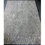 Calvin Klein rug with cream ground and grey lozenge design