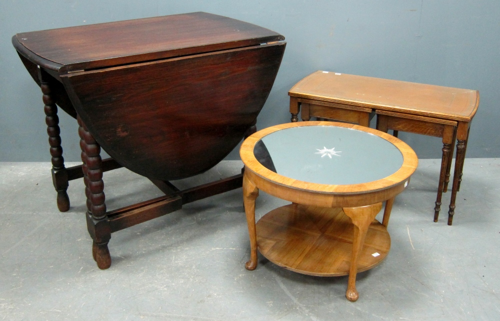 Oak gateleg table, walnut circular table with mirrored centre and a nest of tables
