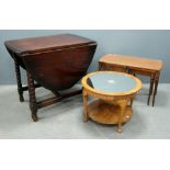 Oak gateleg table, walnut circular table with mirrored centre and a nest of tables