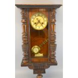 Vienna regulator style walnut cased wall clock with twin train movement,