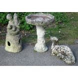 Composite stone bird bath in two sections and a garden fountain in the form of a young boy, together