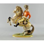 Dresden figure of a military officer on horseback in red jacket.  27cm high.no obvious cracks, chips