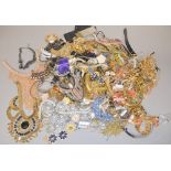 A large quantity of fashion jewellery to include necklaces, brooches and other items.