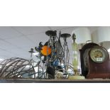 Collection of candleholders, lamps, three clocks and an aneroid barometer,