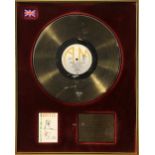 Squeeze, BPI Gold disc presented to Glenn Tilbrook to recognise sales in the United Kingdom of