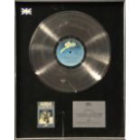 Abba, BPI platinum disc presented to Epic Records to recognise sales in the United Kingdom of more