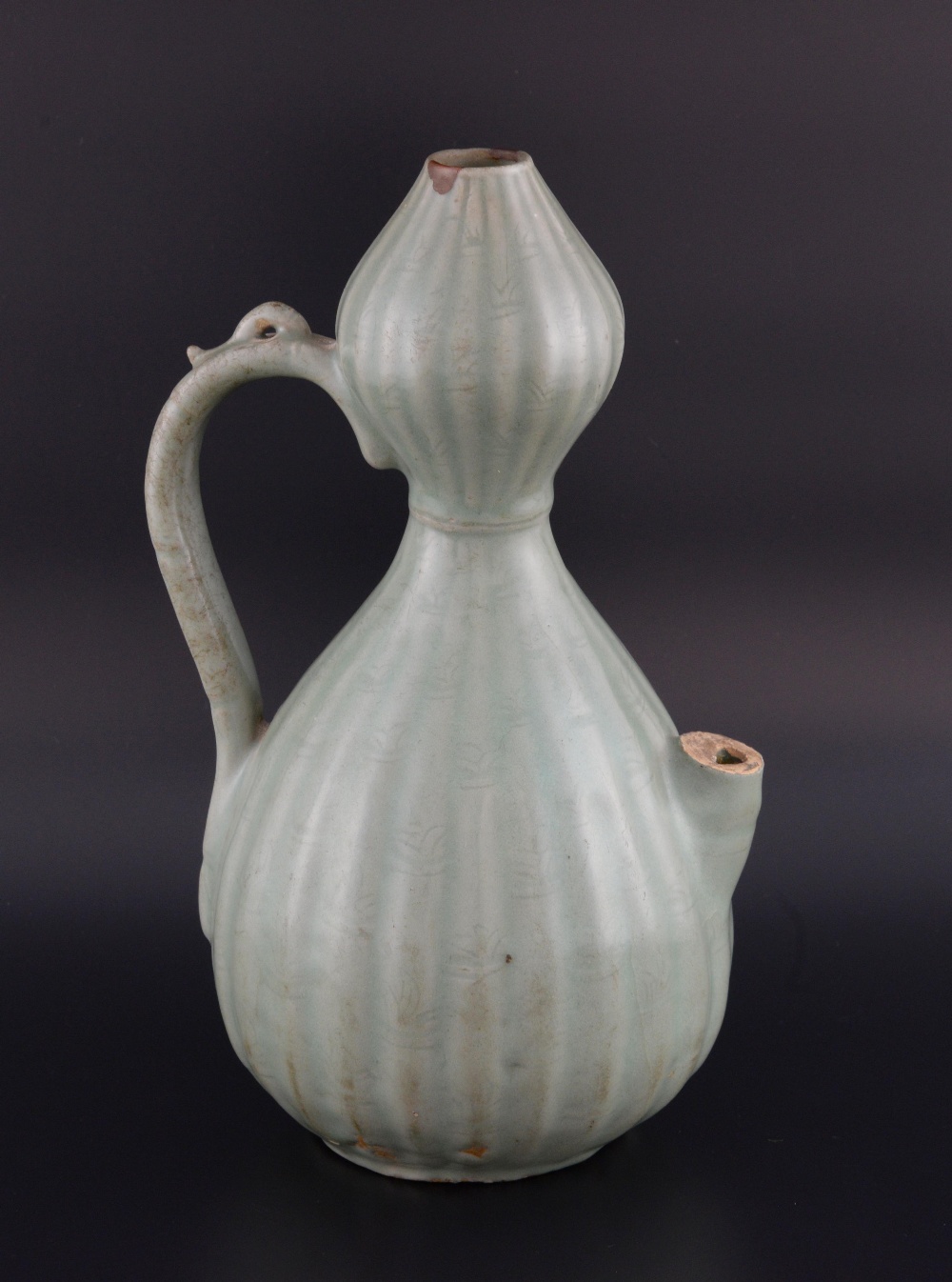 Chinese Longquan celadon double gourd shaped wine pourer, the reeded body with moulded foliage